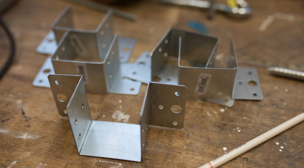 Longitudinal and transverse beams hold the beam shoes together.