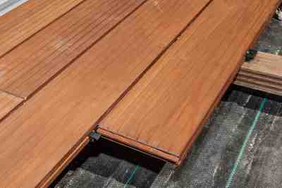 Build a wooden deck with louvered roof