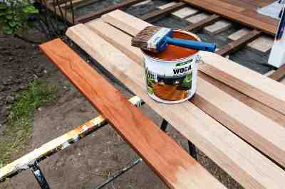 Build a wooden deck with louvered roof