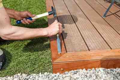 Build a wooden deck with louvered roof