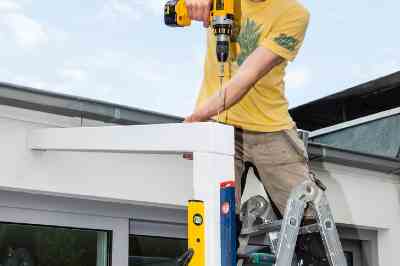 Build a wooden deck with louvered roof