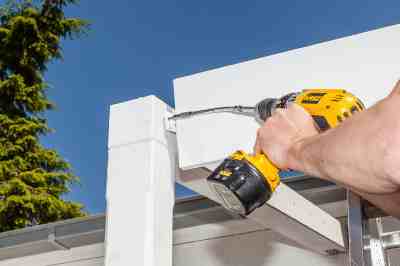Build a wooden deck with louvered roof