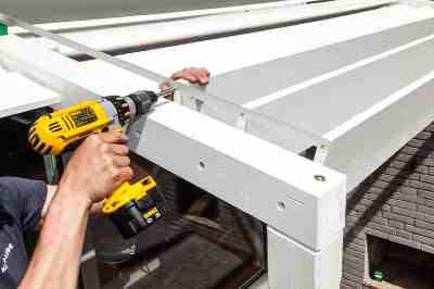Build a wooden deck with louvered roof