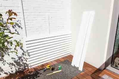 Build a wooden deck with louvered roof