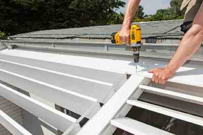 Build a wooden deck with louvered roof