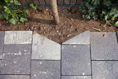 lay paving stones in a driveway
