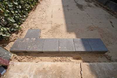 lay paving stones in a driveway