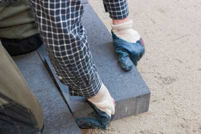 lay paving stones in a driveway